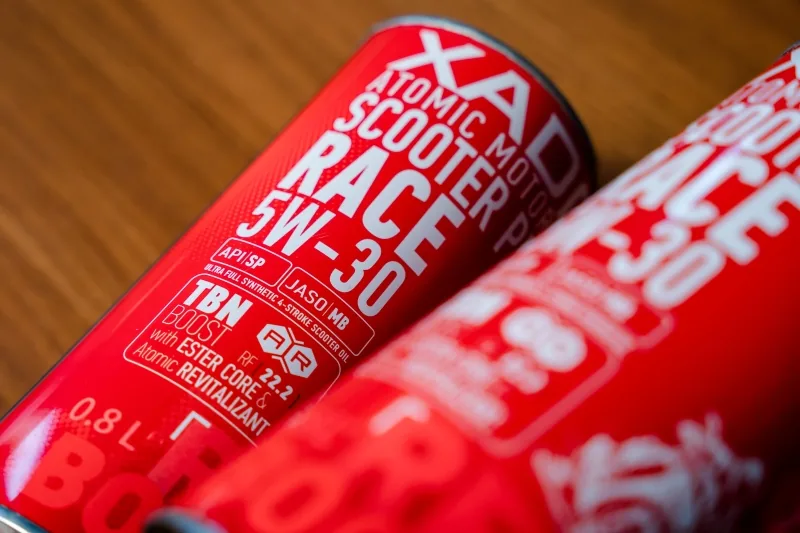 Close-up photo of the red XADO Scooter Pro Race 5W30 packaging